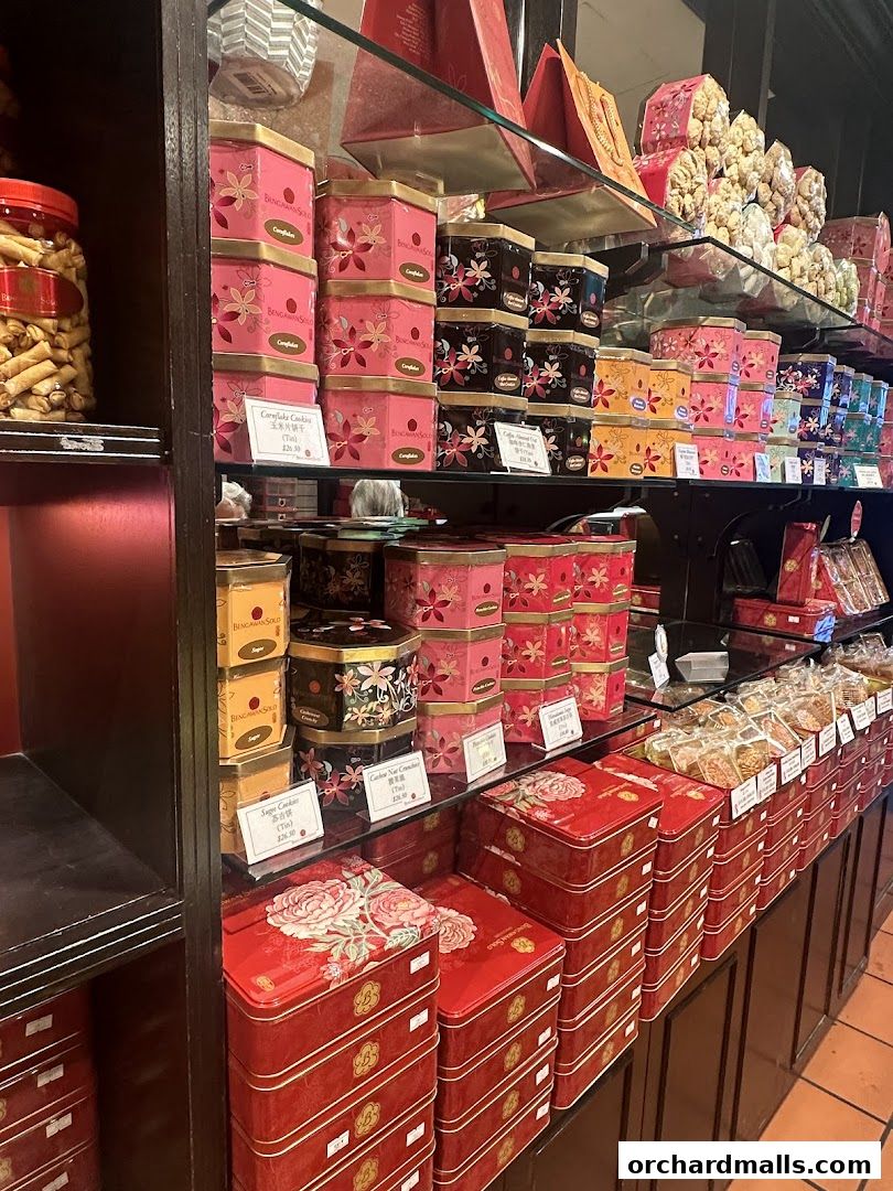 Shelves filled with decorative tins of cookies and snacks from Bengawan Solo.