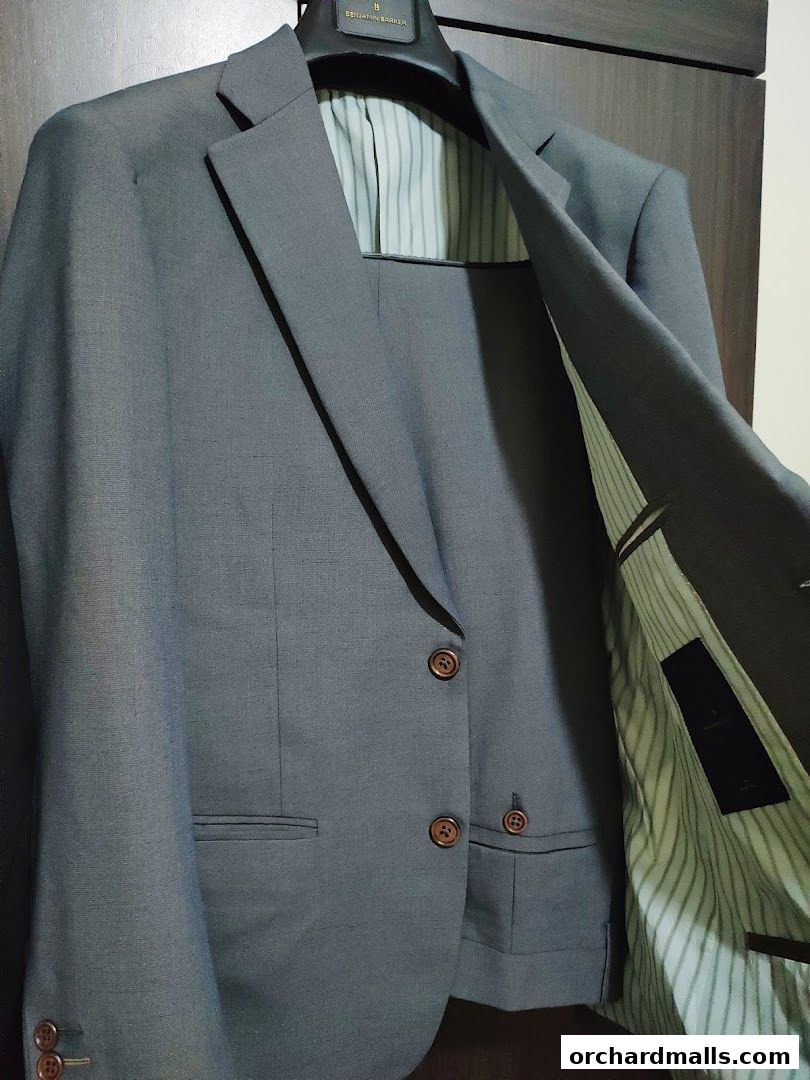 A close-up shot of a grey Benjamin Barker suit jacket with striped lining.