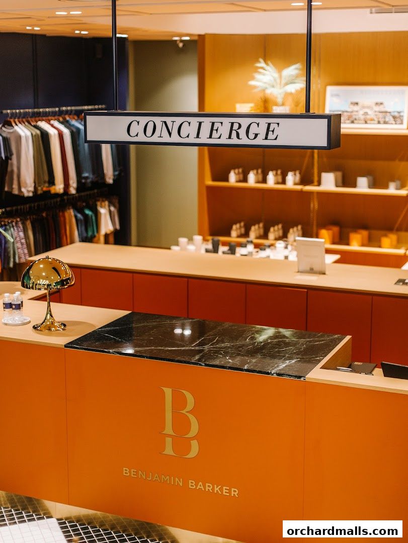 Benjamin Barker shop interior with a concierge desk and clothing racks.