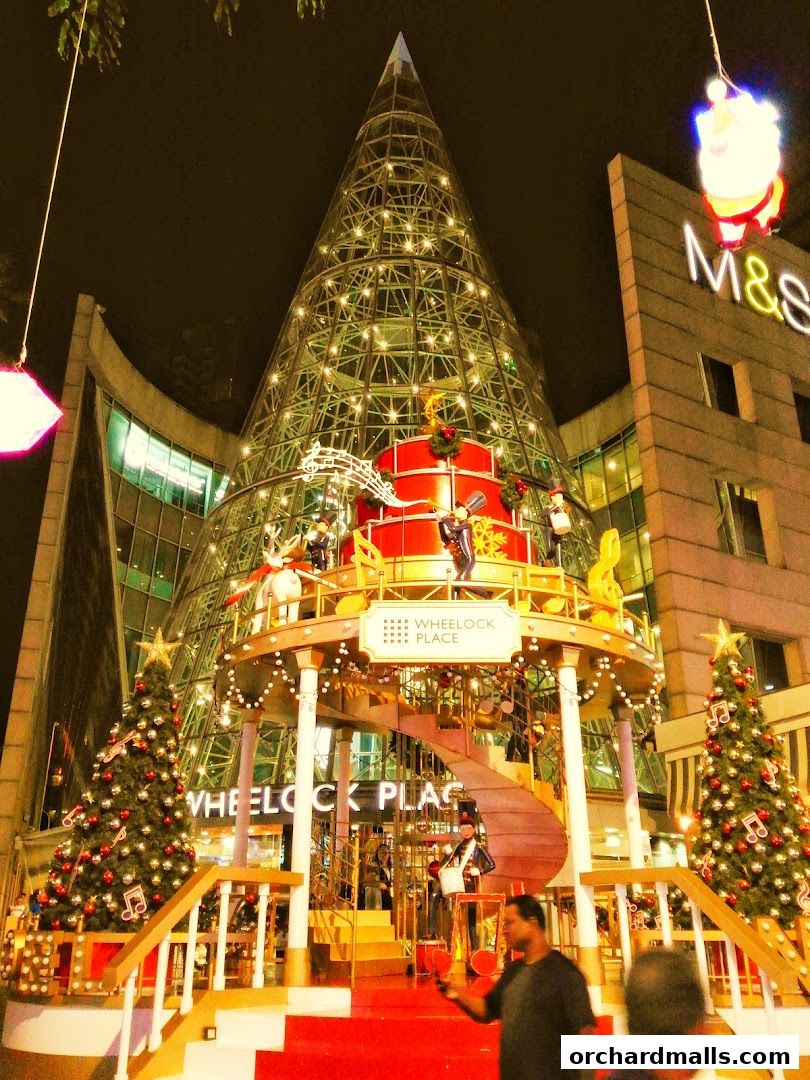 Wheelock Place decorated for Christmas with a large tree and festive lights.