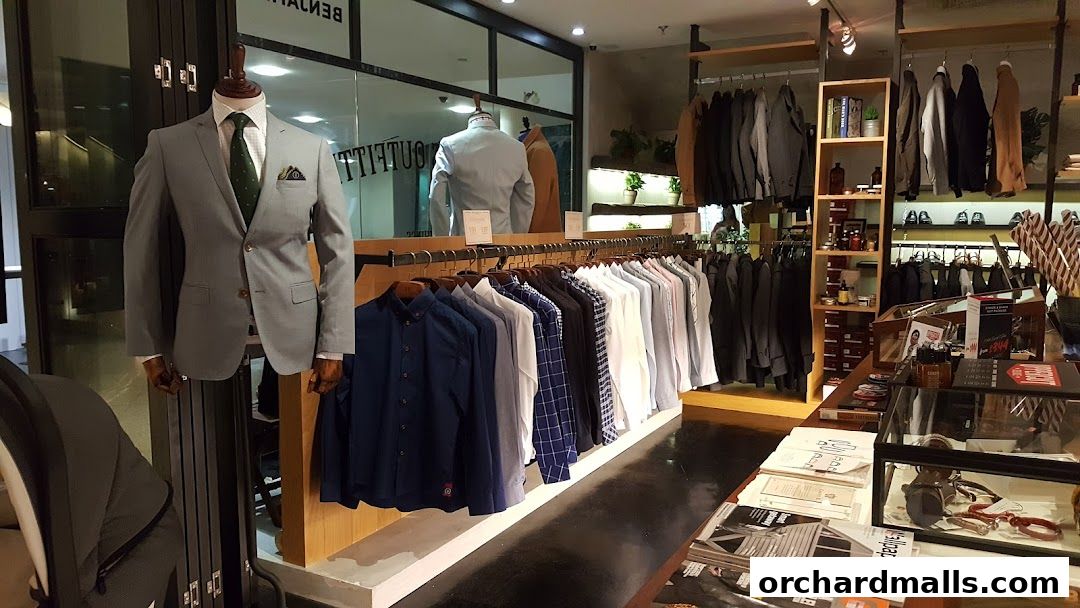 Interior view of Benjamin Barker, Wheelock Place, showcasing men's suits and shirts.