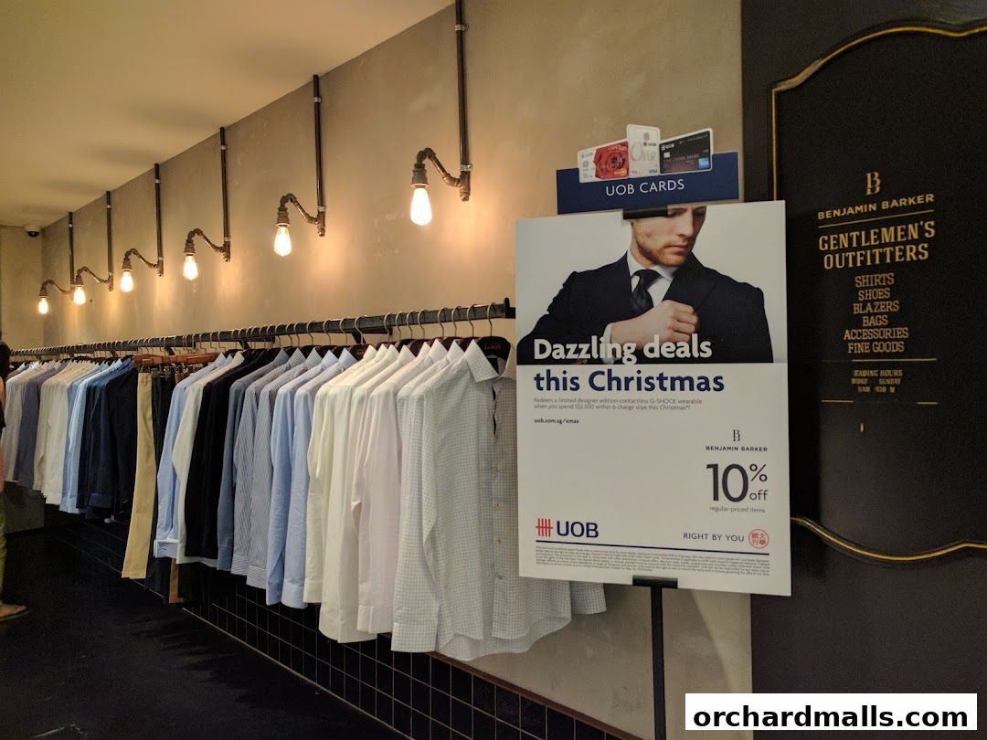 Benjamin Barker store interior with shirts on display and a Christmas promotion sign.