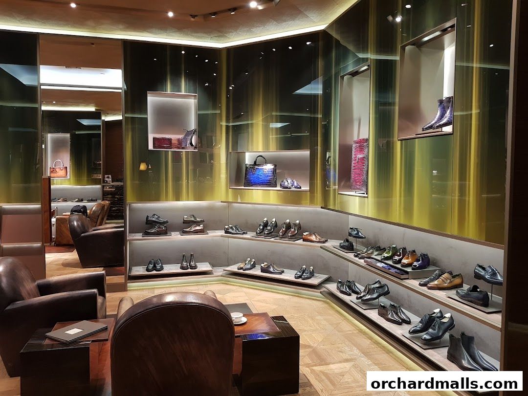 Luxurious interior of a Berluti store showcasing elegant footwear and handbags.