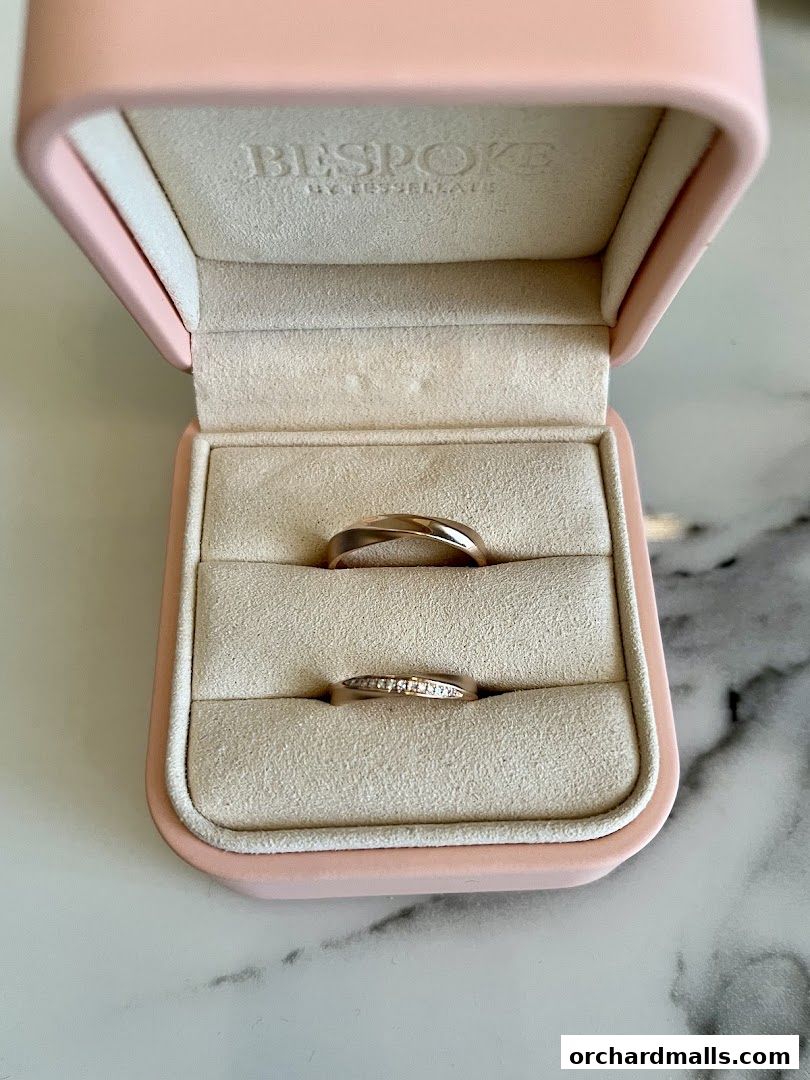 Two elegant rings displayed in a pink velvet jewelry box from Bespoke By Tessellate.