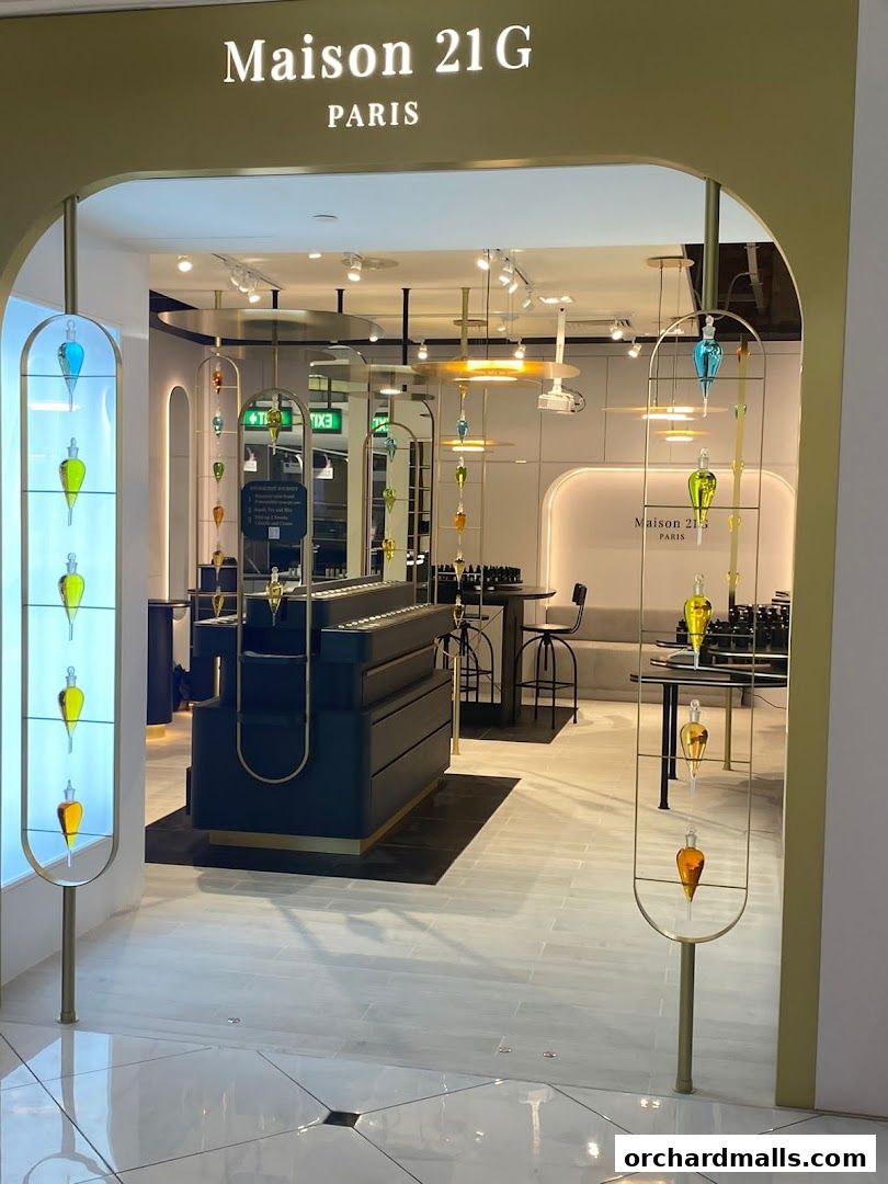 Entrance to Maison 21G, a bespoke fragrance house with elegant displays of perfume bottles.