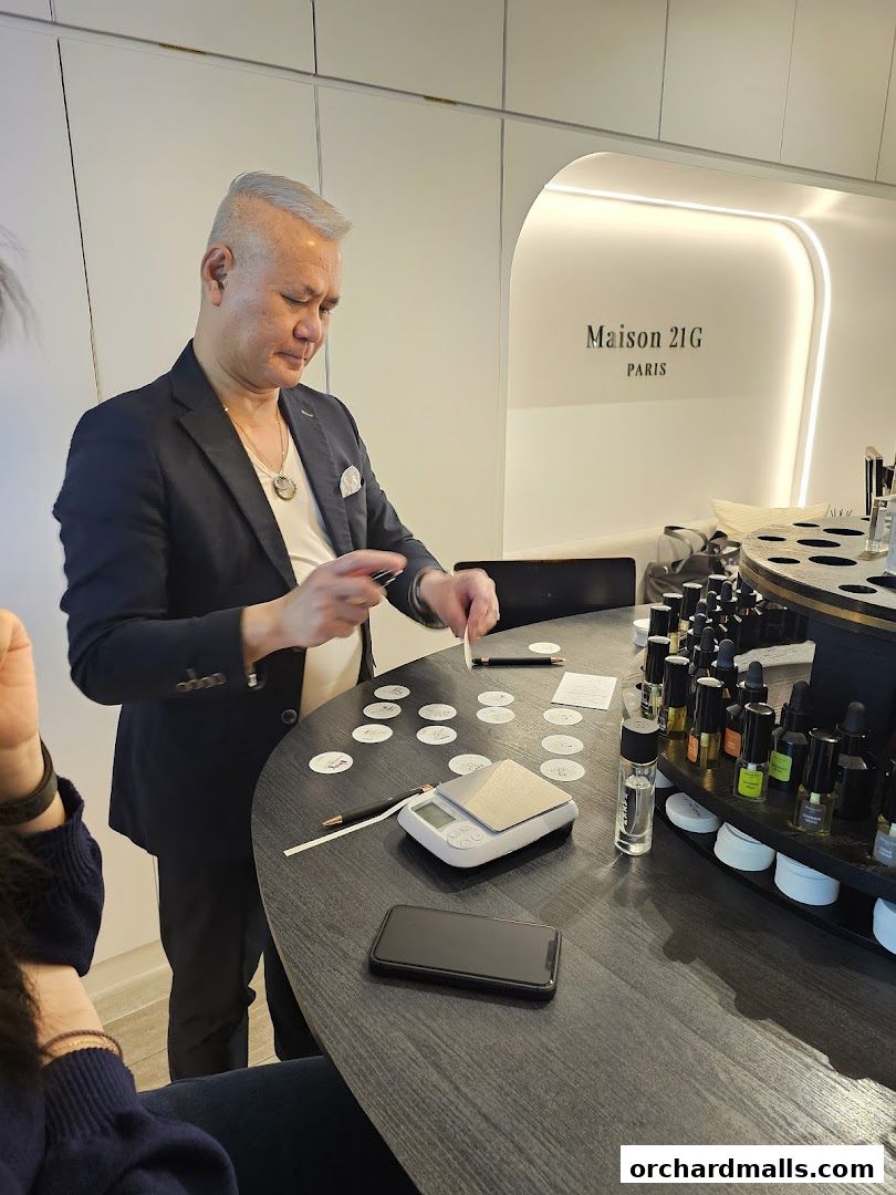 A perfumer is creating a custom scent at Maison 21G in Takashimaya Singapore.