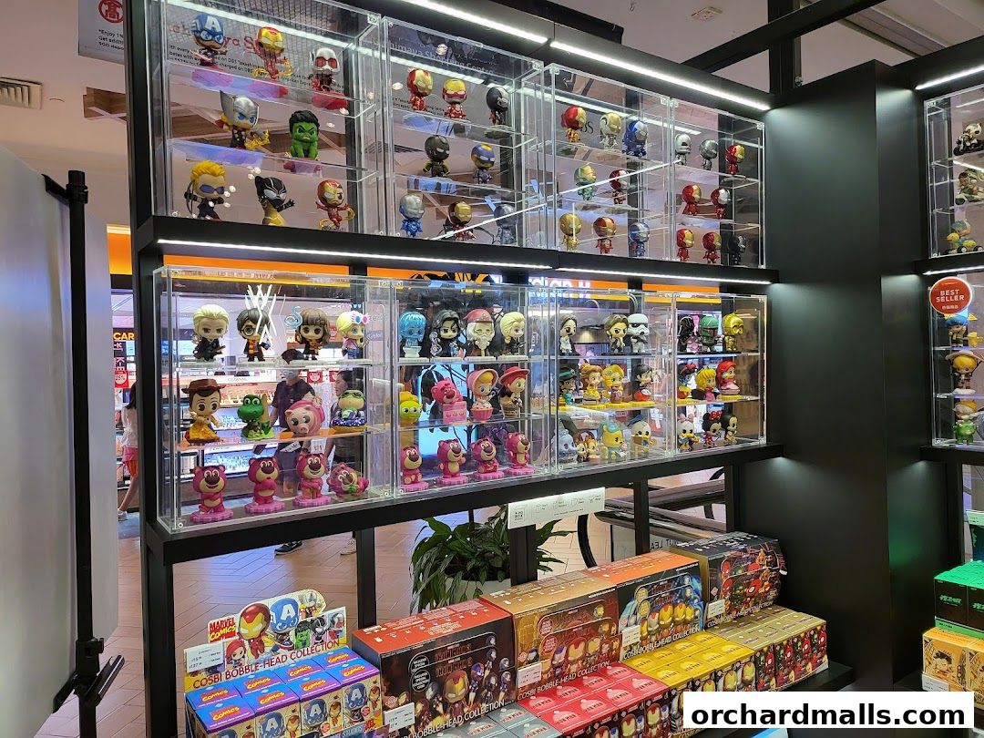 Display shelves filled with collectible figurines and merchandise from popular franchises.