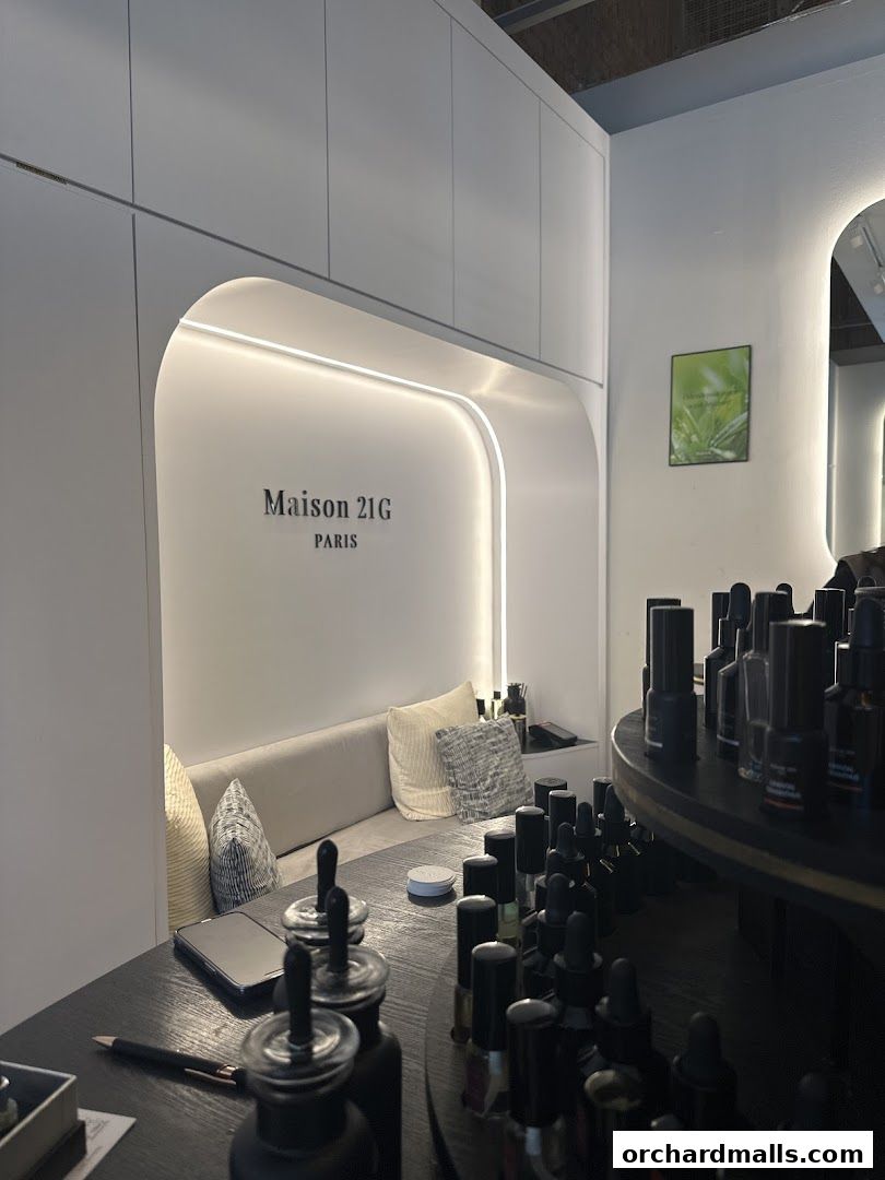 Interior of Maison 21G, a bespoke fragrance house, with perfume bottles on display.