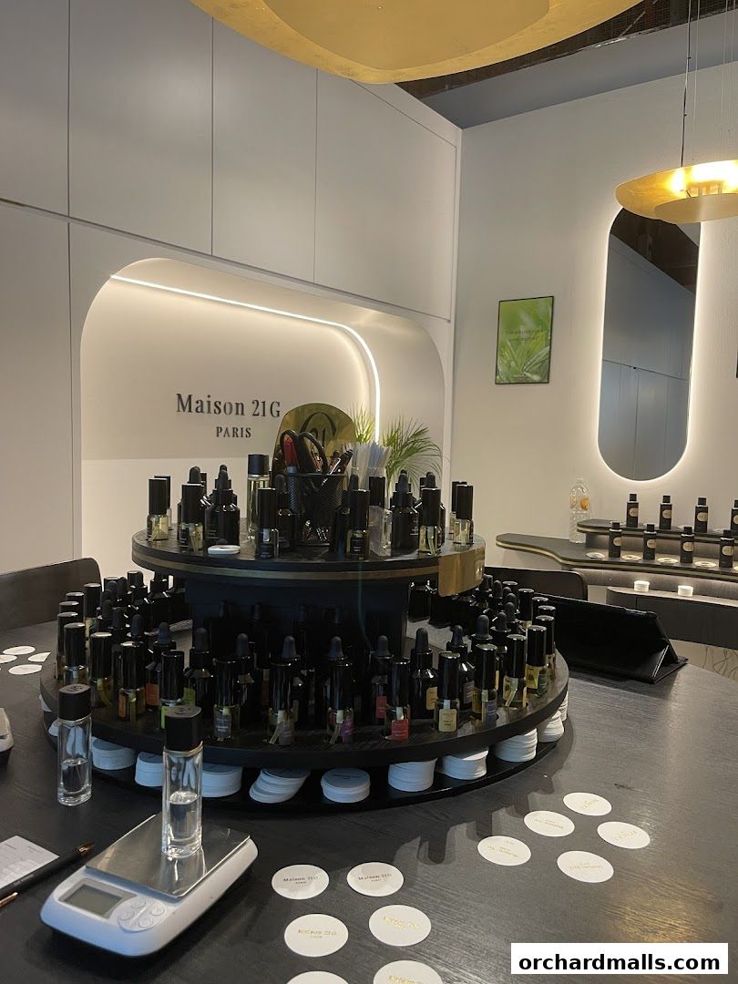 Interior of Maison 21G, a bespoke fragrance house, showcasing perfume bottles and a weighing scale.