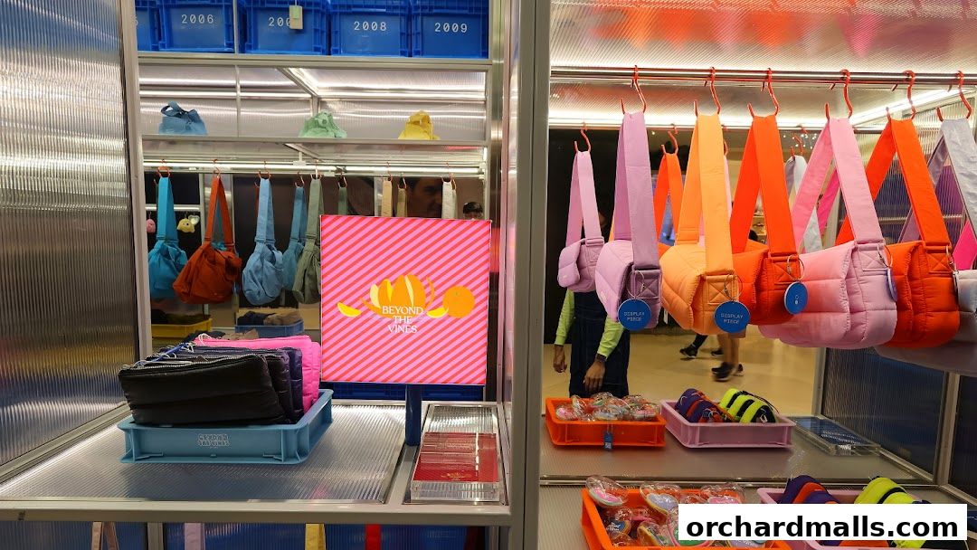 A vibrant display of colorful quilted bags and accessories at Beyond The Vines.