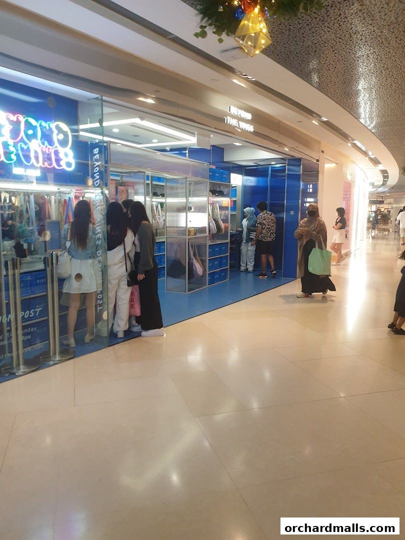 The exterior of the Beyond The Vines Design Post shop at ION Orchard, showcasing its modern blue and white interior.