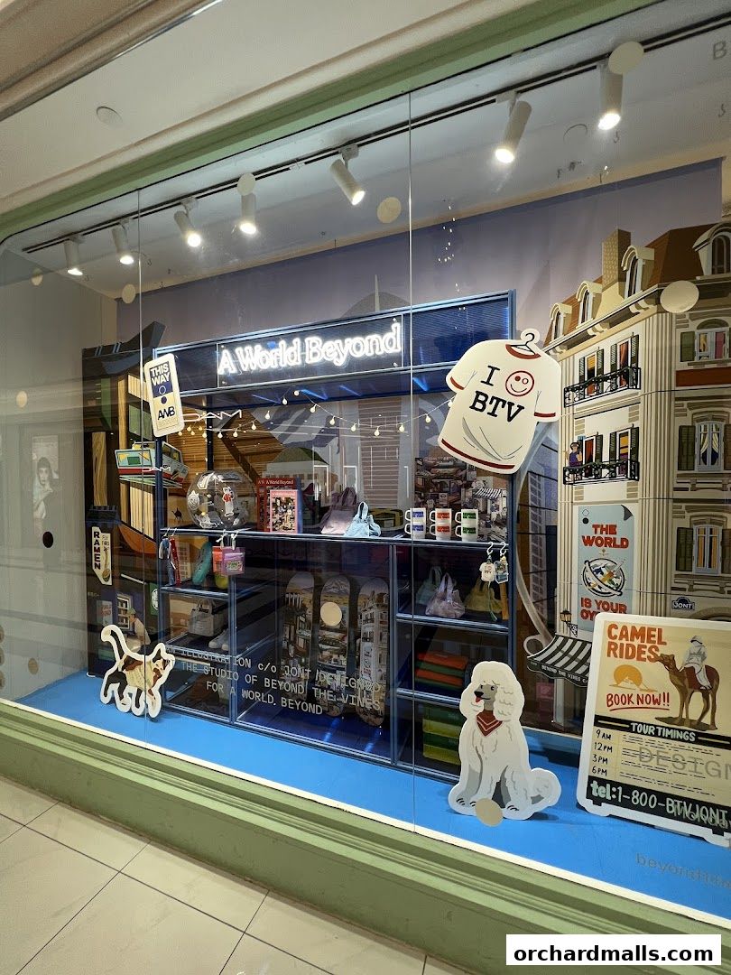 A shop window display featuring a "A World Beyond" theme with various products and playful cutouts.