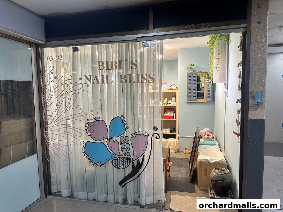 The entrance to Bibis Nail Bliss, a nail salon with decorative curtains and interior decor.