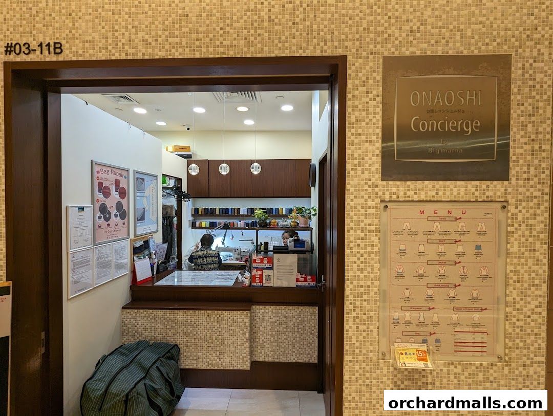 A menu board displays prices for laundry and dry cleaning services for various clothing items.