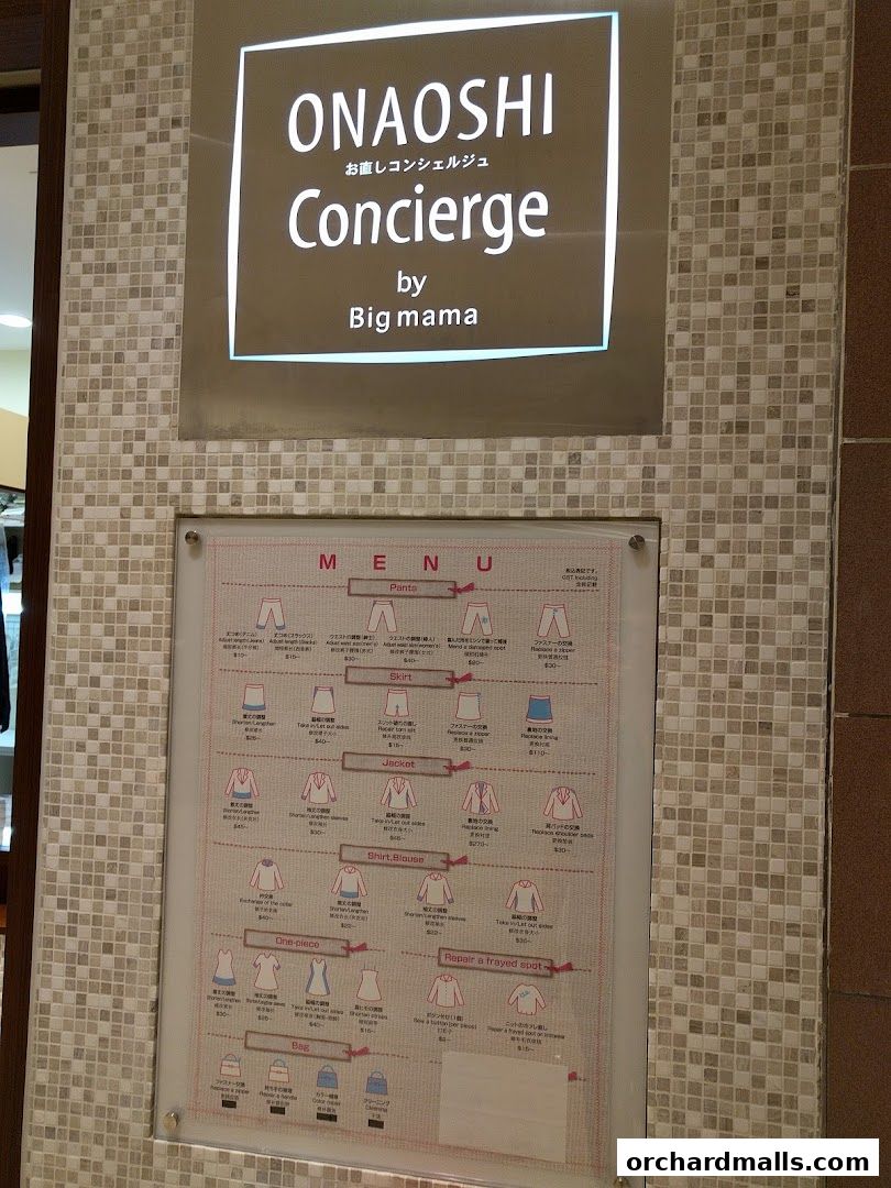 A menu board for laundry and dry cleaning services with various clothing items and prices.