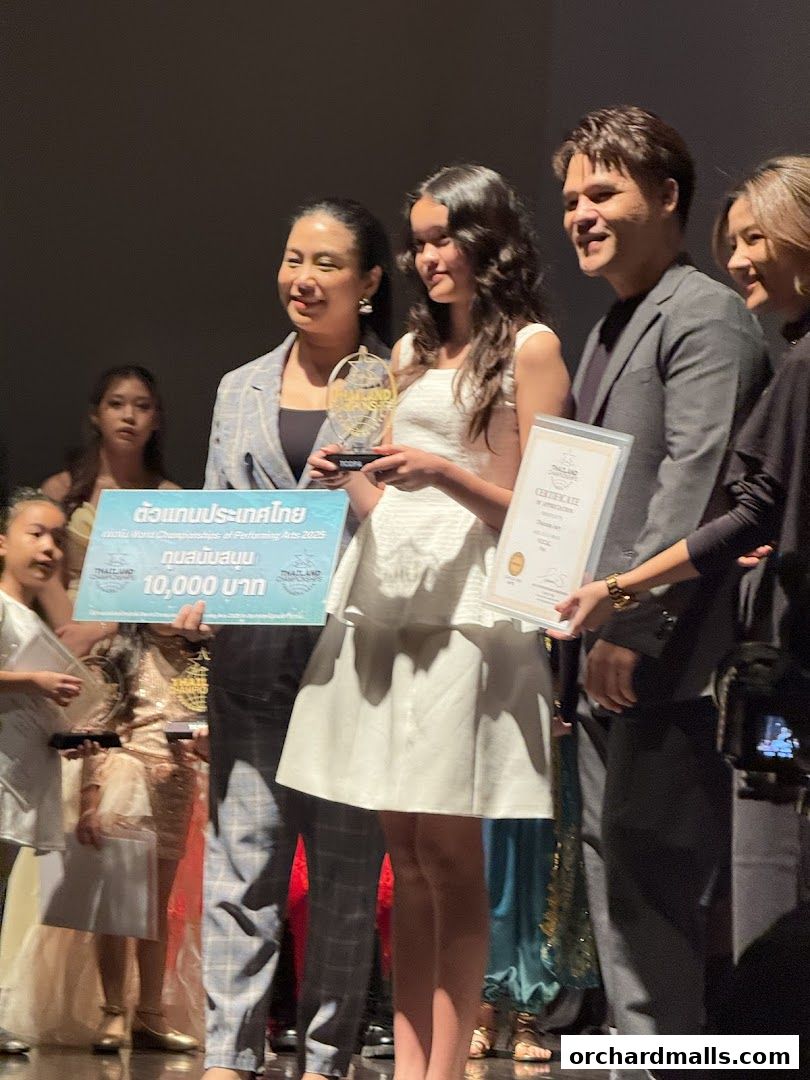 People on stage receiving awards and certificates at an event.