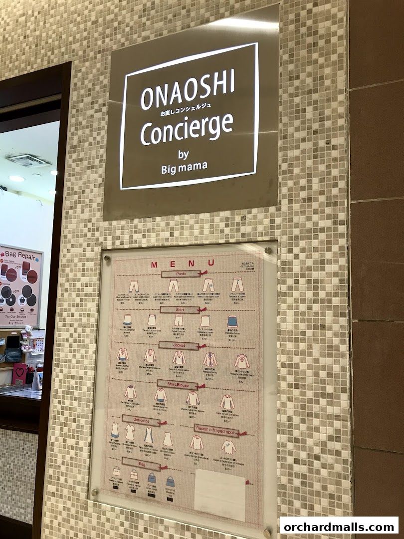 A menu board for ONAOSHI Concierge by Big mama, detailing laundry and repair services.