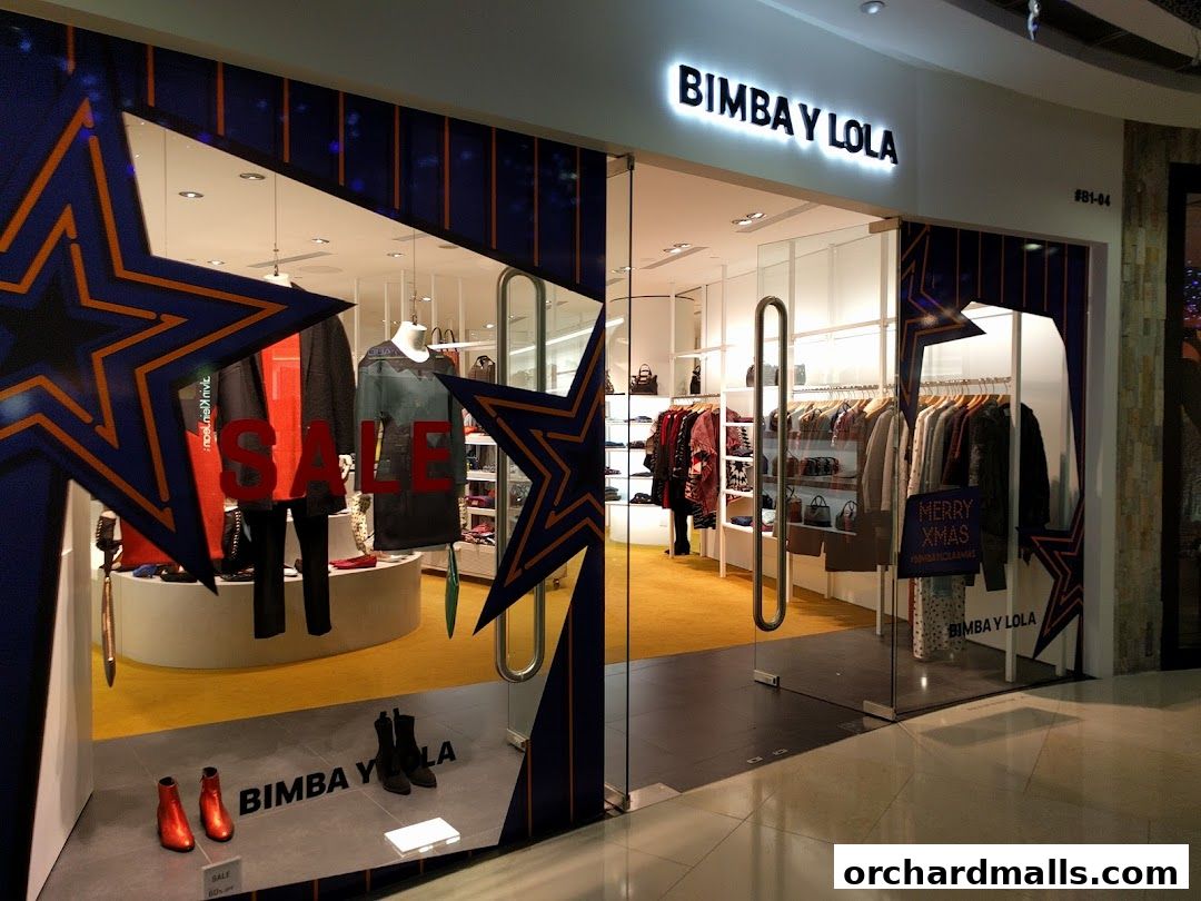 The BIMBA Y LOLA store features a festive window display with clothing and accessories, and a "SALE" sign.
