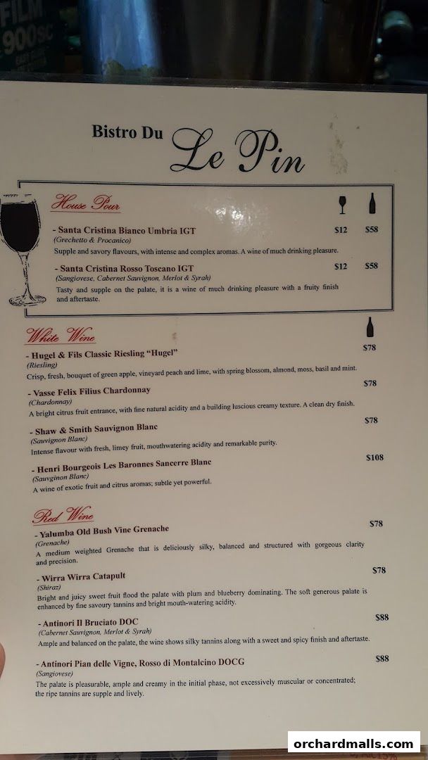 A wine menu for Bistro Du Le Pin, featuring house pours, white, and red wines.