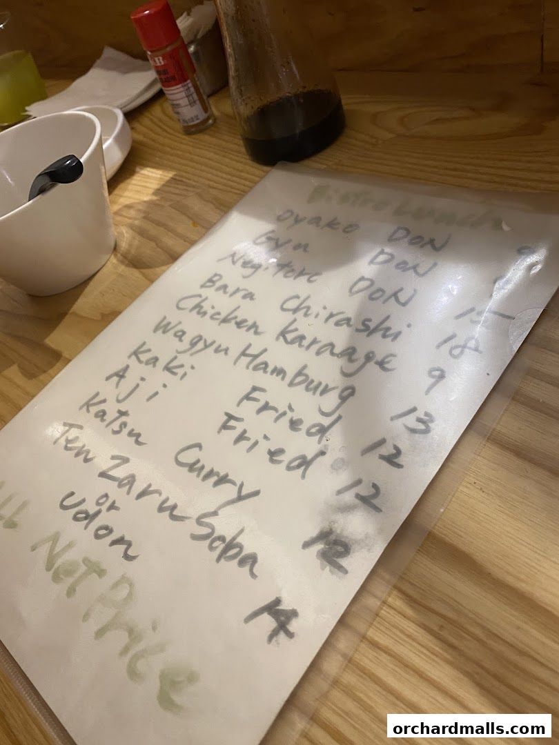 A handwritten menu from Bistro Du Le Pin featuring lunch specials and prices.