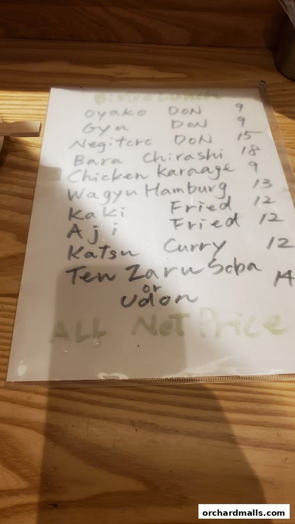 A handwritten menu for Bistro Du Le Pin with various Japanese dishes and prices.