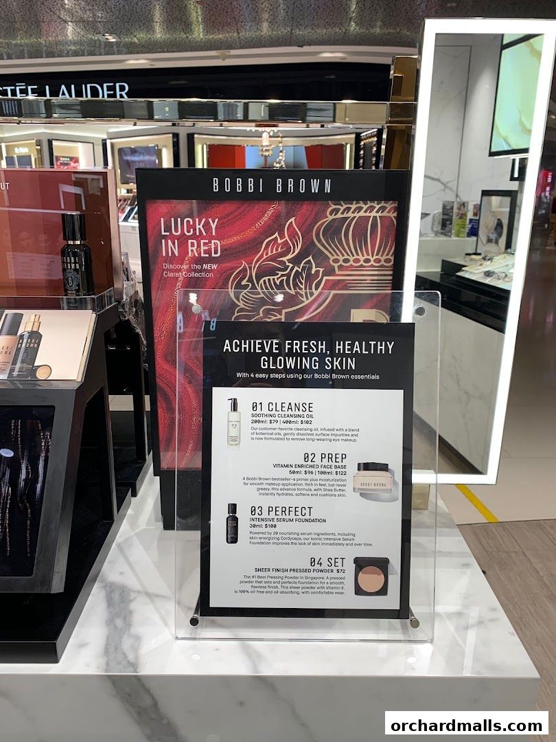 Bobbi Brown counter displaying 'Lucky in Red' collection and skincare routine steps.