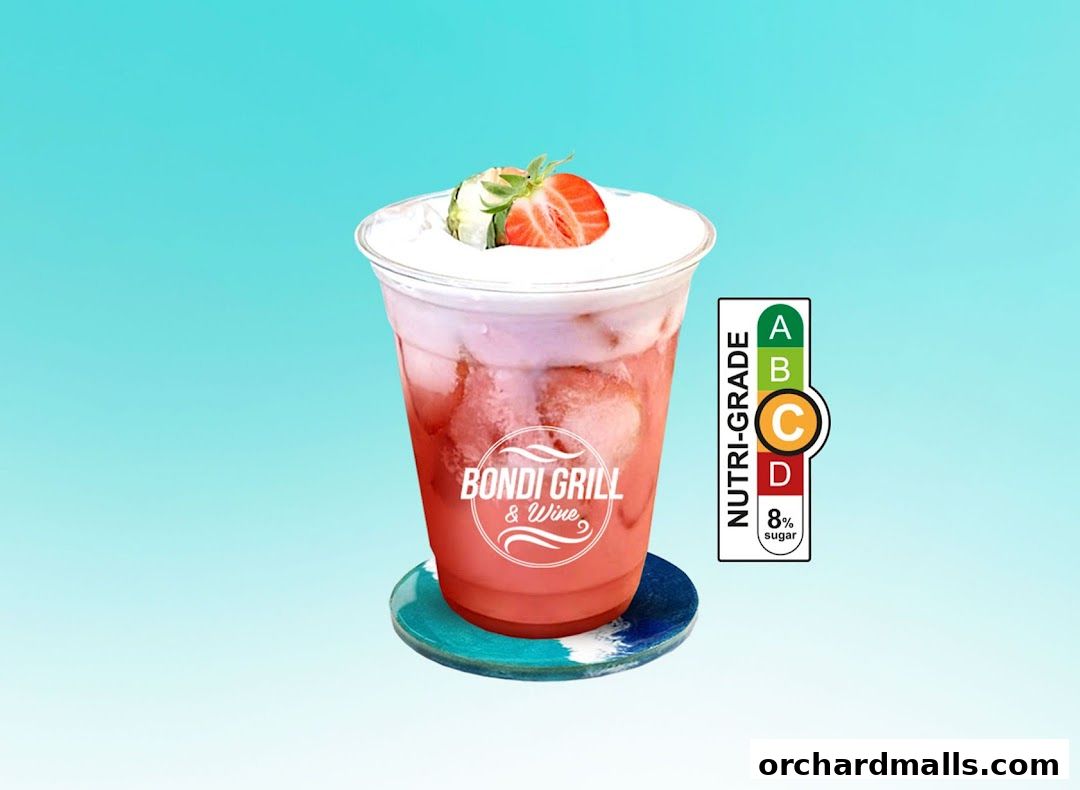 A refreshing strawberry drink with cream topping and a Nutri-Grade label.