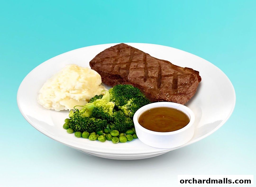 A grilled steak served with mashed potatoes, broccoli, peas, and gravy.