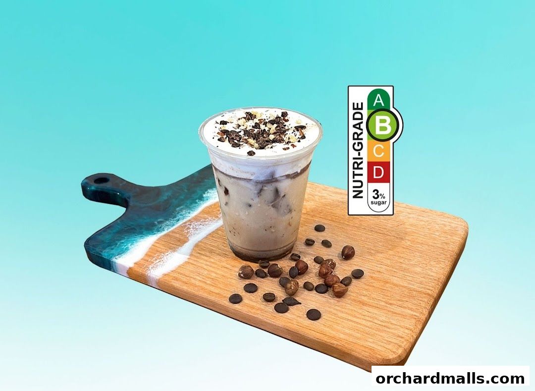 A creamy beverage with toppings on a wooden board with nuts and chocolate chips.