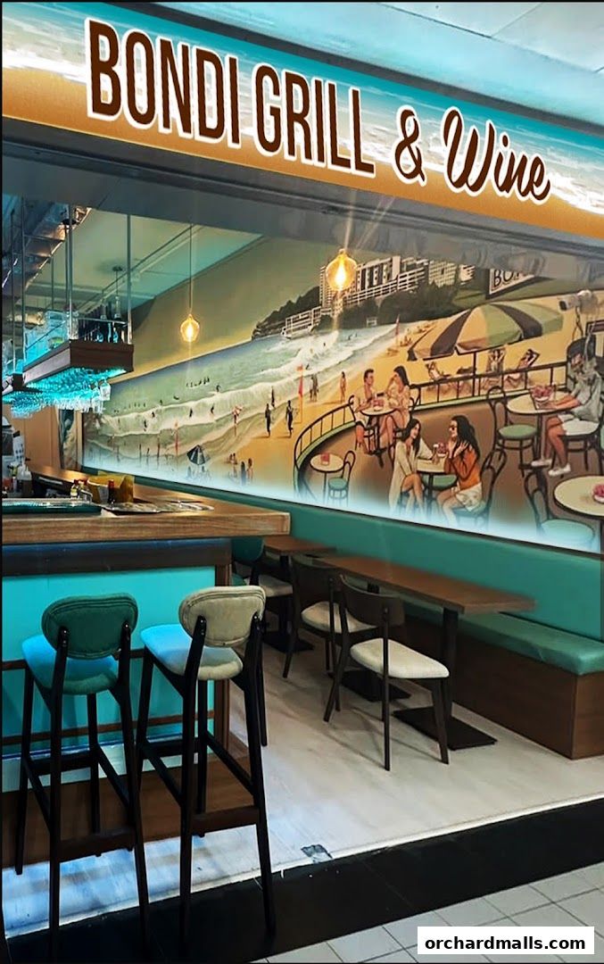 Interior of Bondi Grill & Wine with a beach mural, bar, and seating.