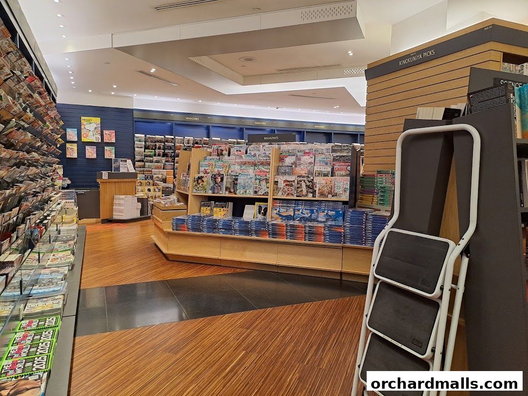 Interior view of a large bookstore with shelves full of magazines and books.