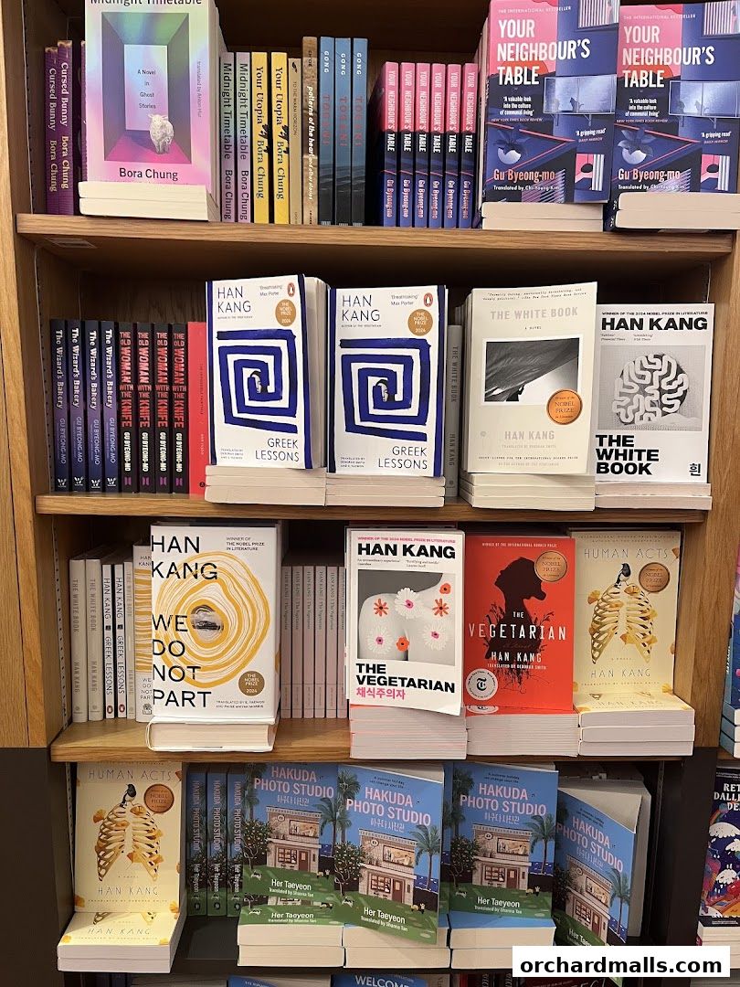 A well-stocked bookshelf displaying a variety of books, including fiction and non-fiction titles.