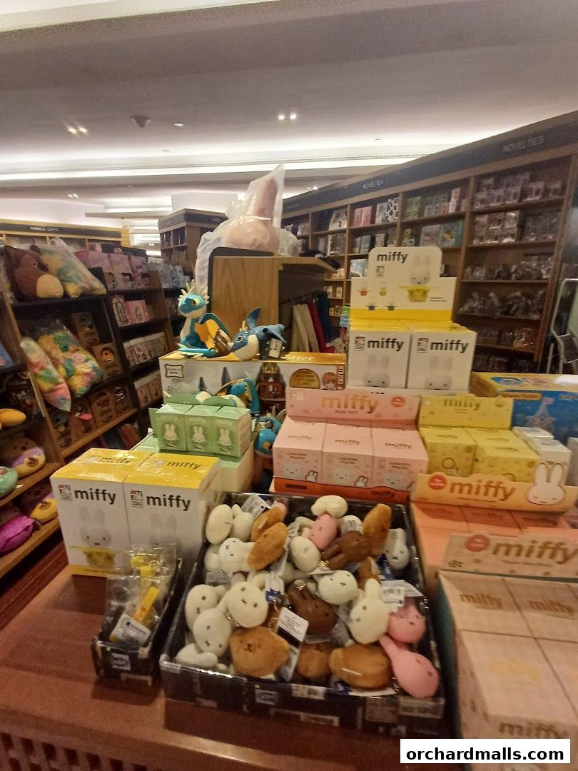 A display of Miffy merchandise and plush toys inside a bookstore.