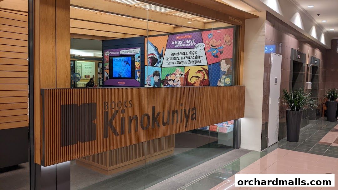 The entrance of Books Kinokuniya Singapore Main Store, featuring colorful graphic novel displays.