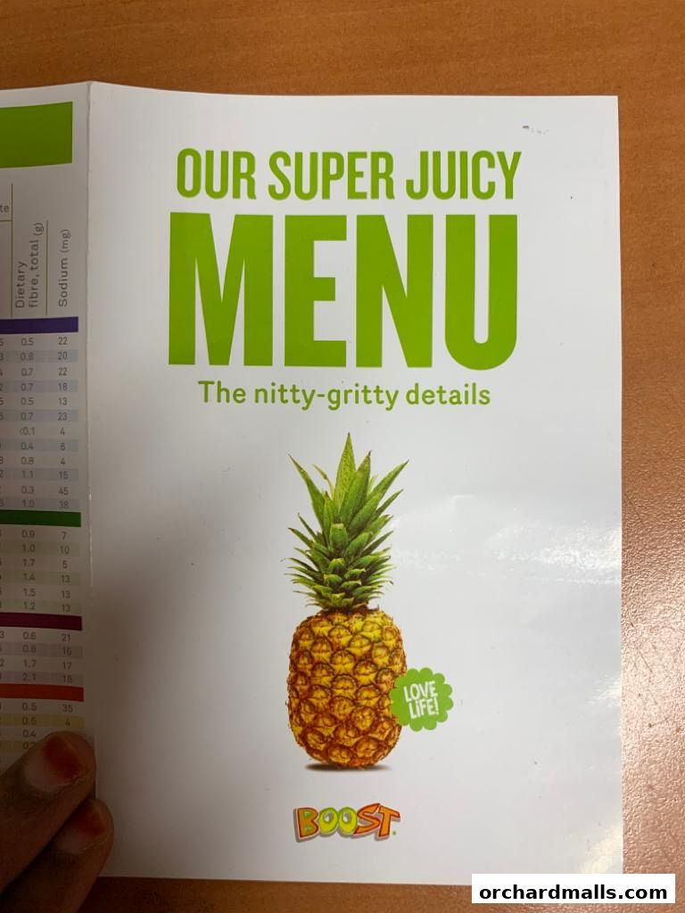 A menu from Boost Juice featuring the title 'Our Super Juicy Menu' and a pineapple.