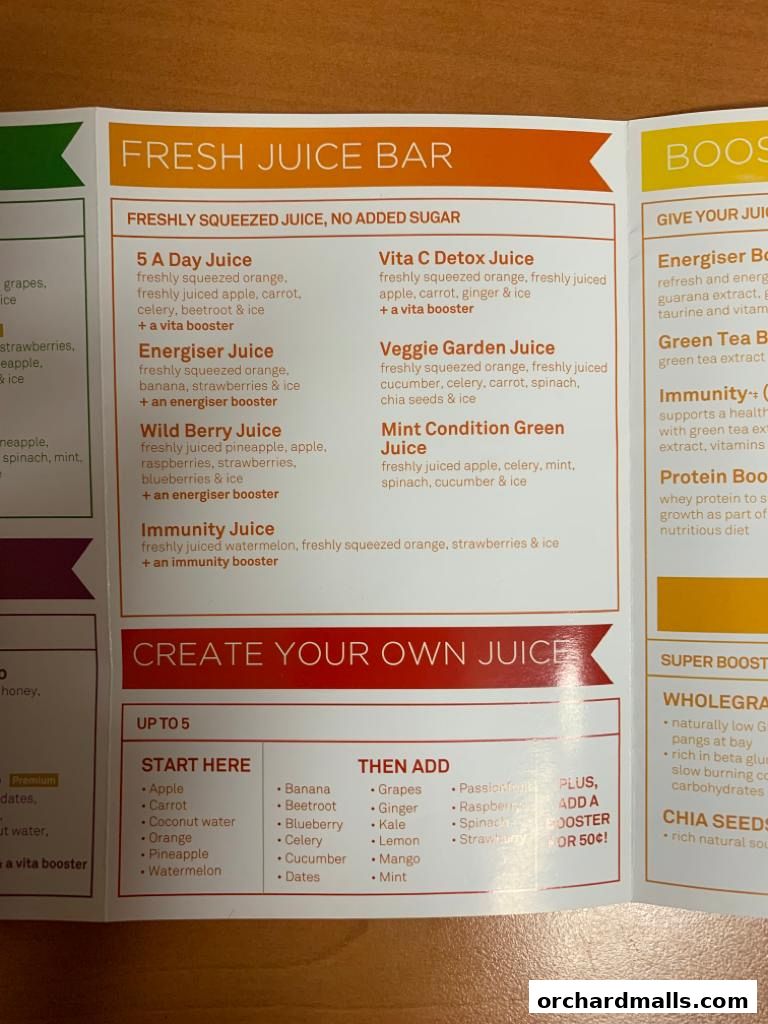 A menu for Boost Juice featuring fresh juices, boosters, and custom juice options.