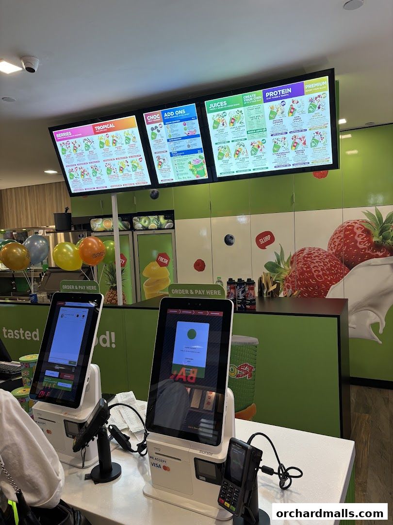 Digital menus and self-order kiosks at Boost Juice ION Orchard.