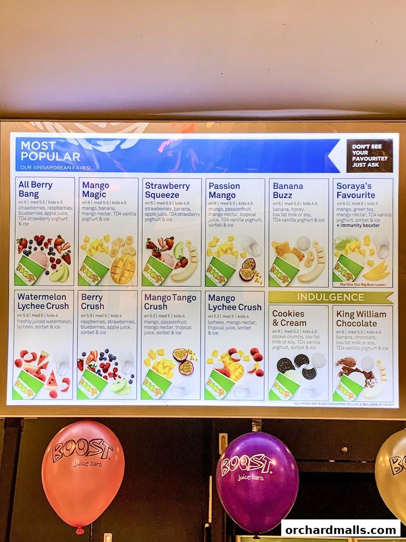 A menu board displaying popular and indulgent Boost Juice drinks with images and prices.