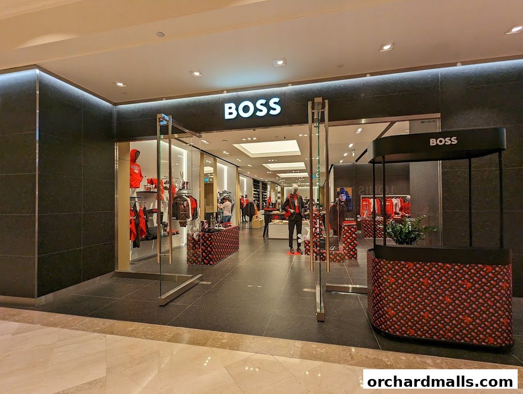 The exterior of a BOSS store showcasing stylish apparel and accessories.