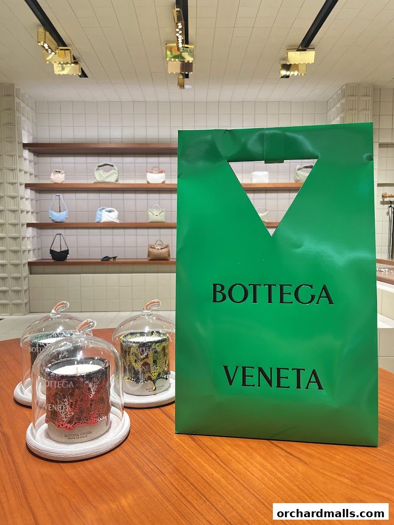 Bottega Veneta Singapore Takashimaya shop interior with handbags and candles.