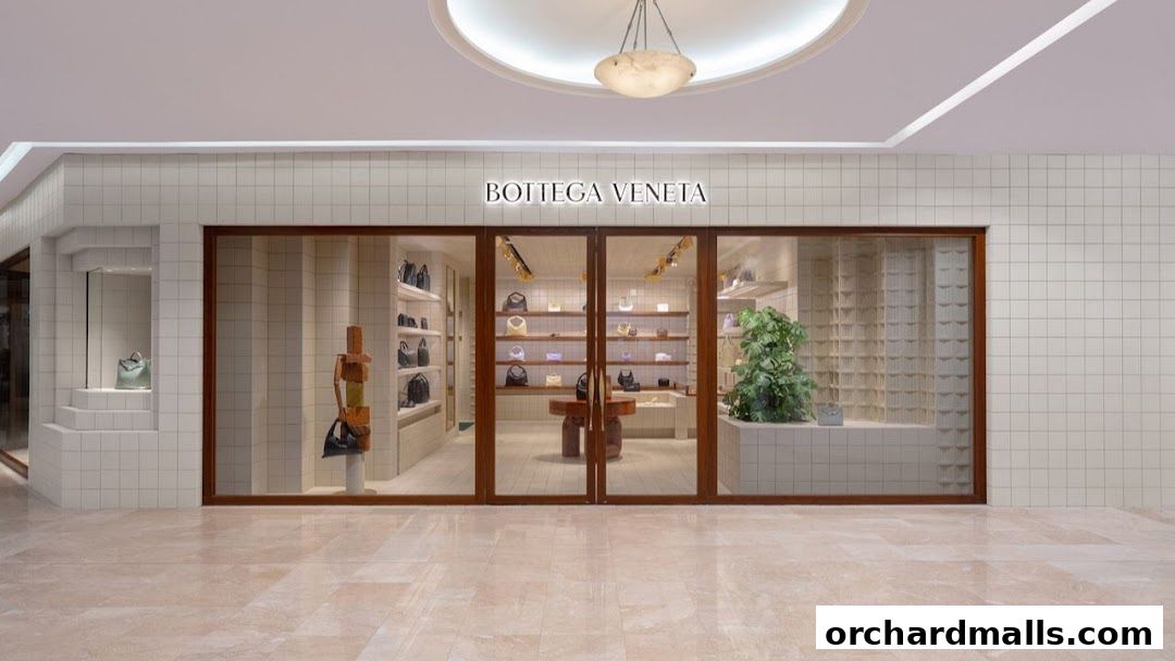 The elegant storefront of Bottega Veneta, showcasing handbags and accessories.