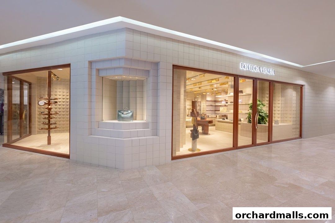 The Bottega Veneta store entrance with display windows showcasing luxury handbags and accessories.