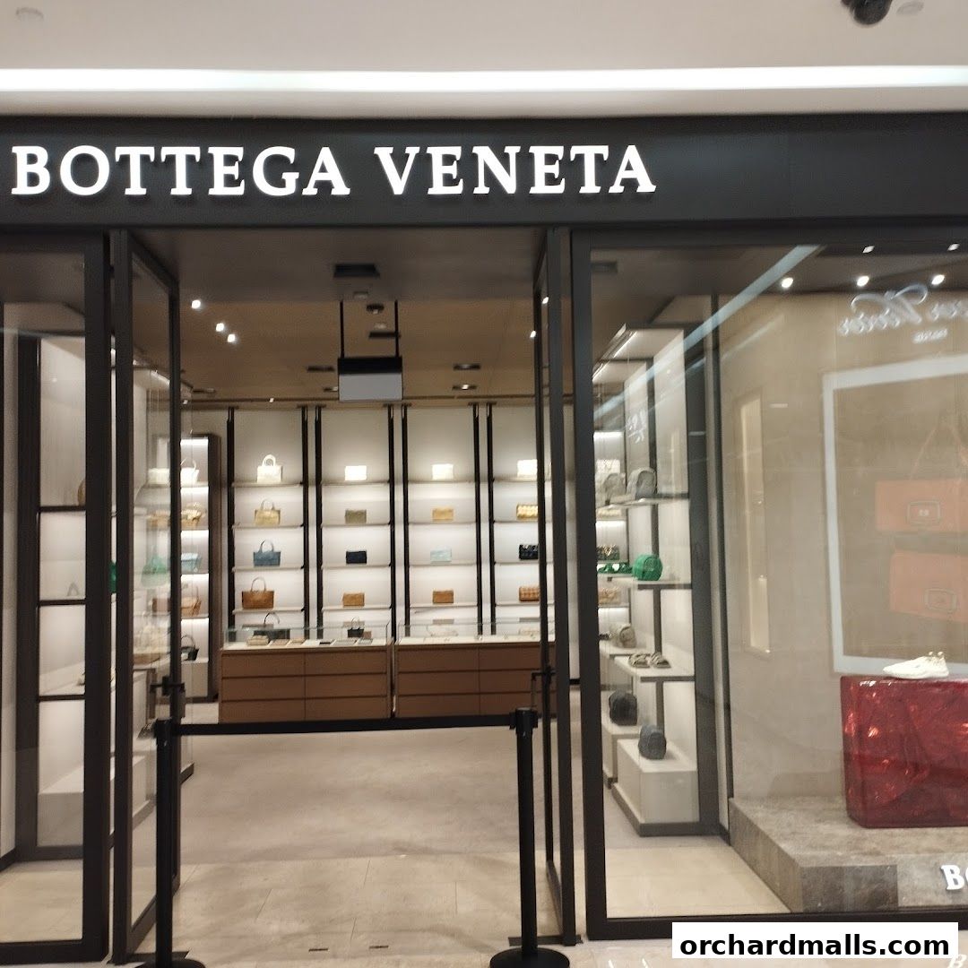 The entrance to the Bottega Veneta store, showcasing handbags and accessories on display.