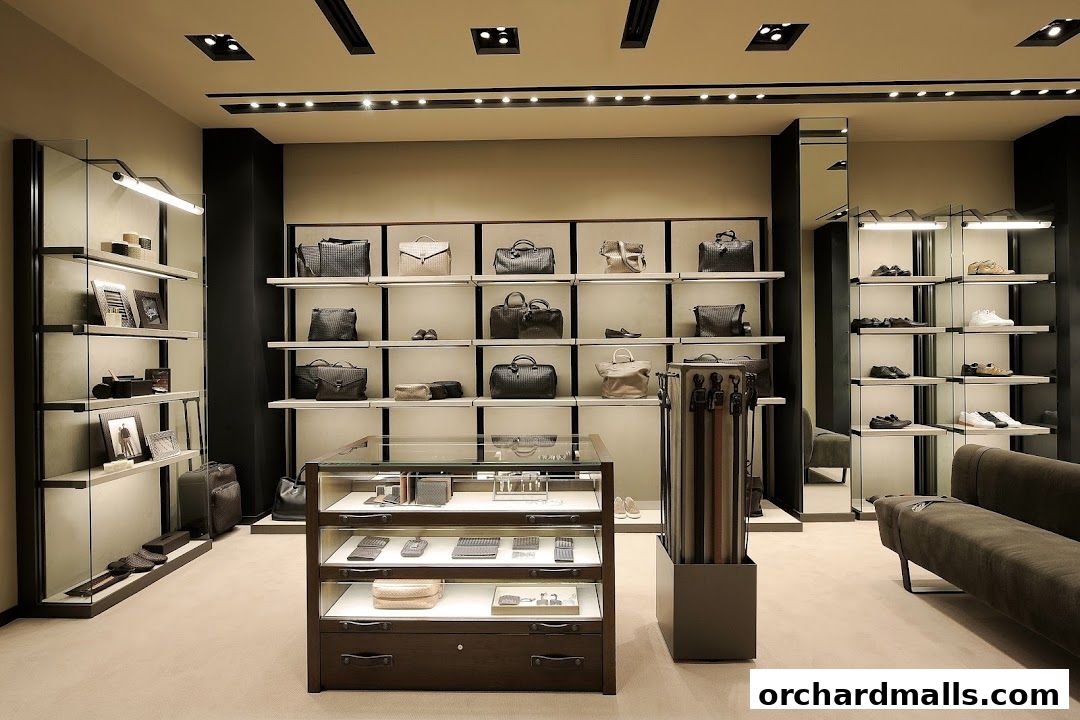 Interior of a luxury Bottega Veneta store showcasing handbags, shoes, and accessories.