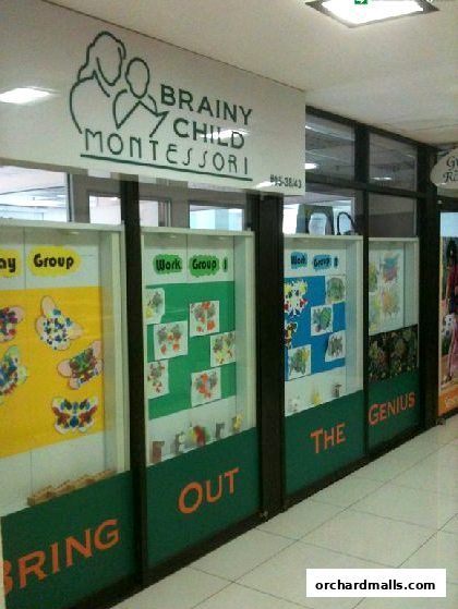 Exterior of Brainy Child Montessori Learning Centre with children's artwork displayed.