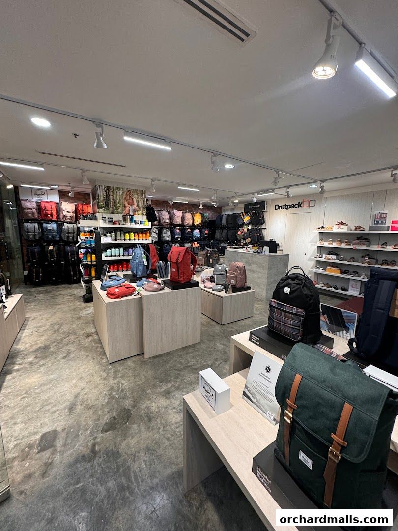 Interior view of a retail store showcasing a wide selection of backpacks and bags.