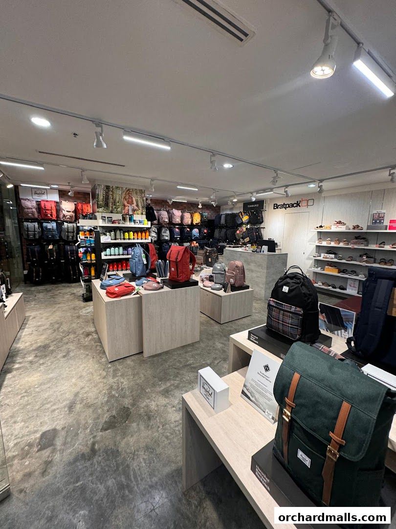 Interior view of Bratpack Wheelock Place showcasing a wide selection of backpacks and bags.