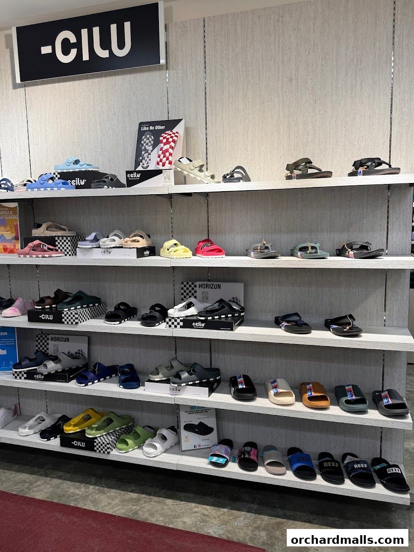 Shelves display a variety of sandals and flip-flops from the brand CILU.