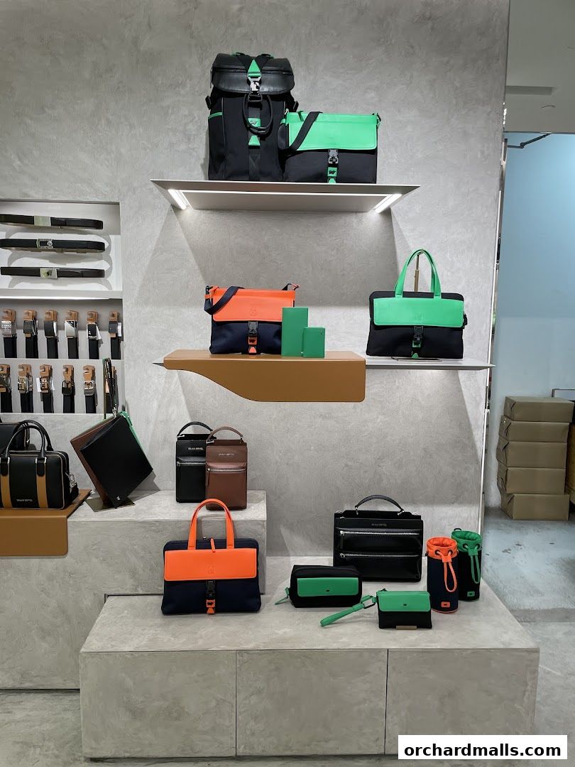 A display of Braun Büffel bags and belts in various colors and styles.