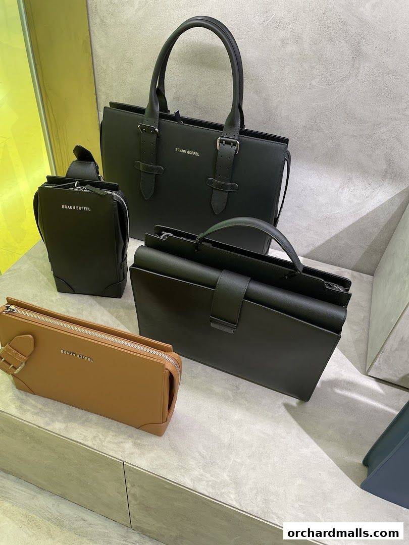 A display of Braun Büffel handbags and accessories in various styles and colors.